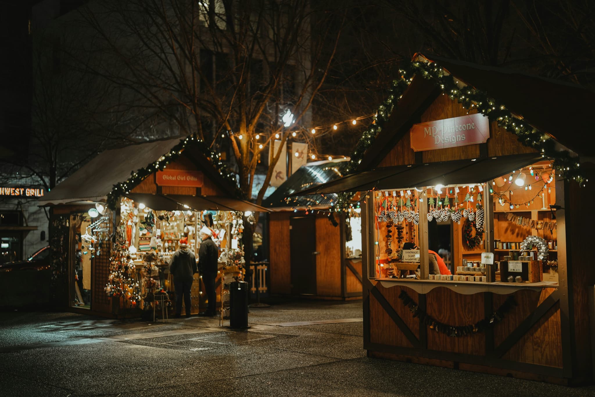 Christmas market stalls glowing at dusk in Germany