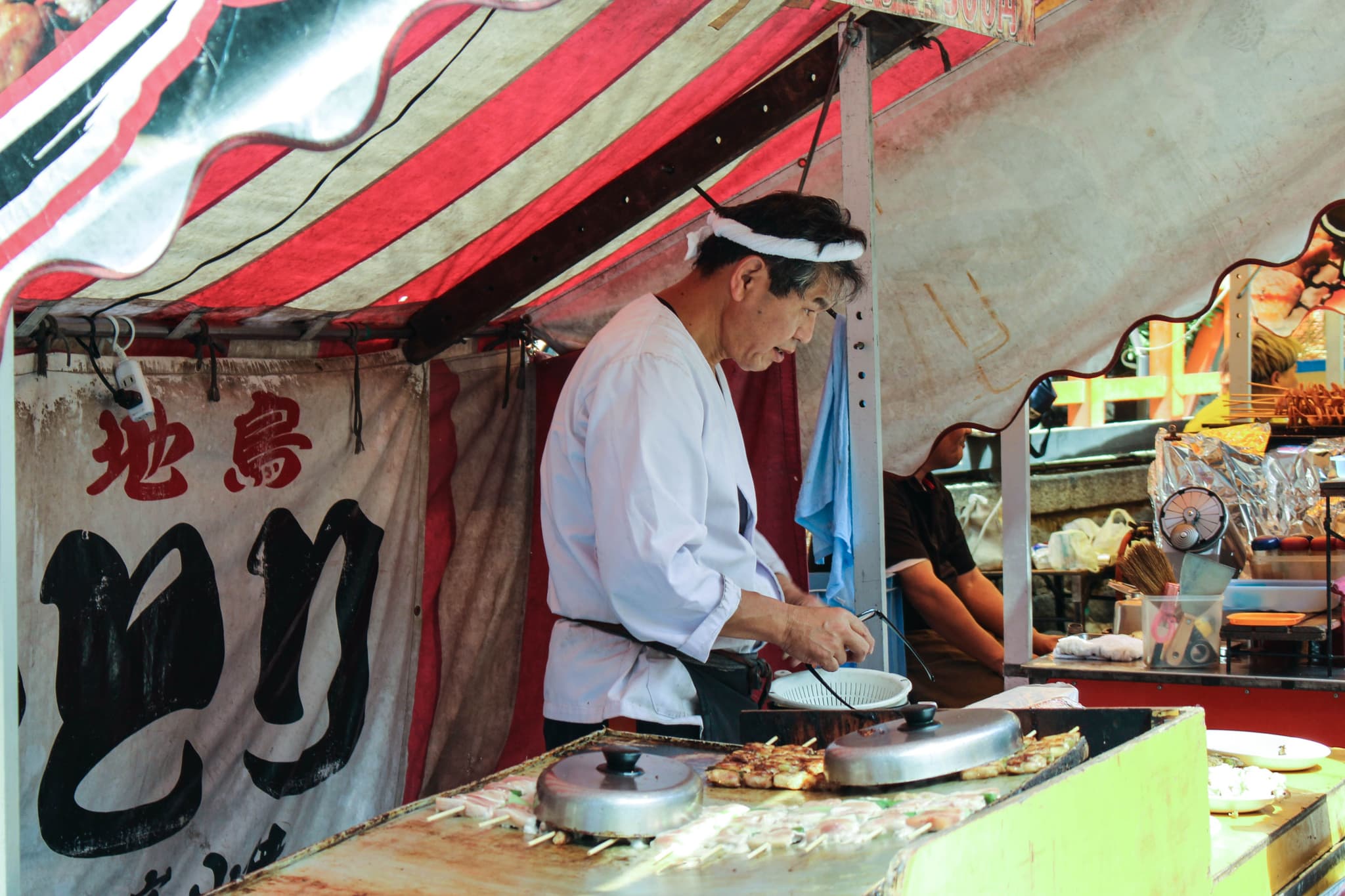 Yatai food stall selling takoyaki and yakisoba at a Japanese festival