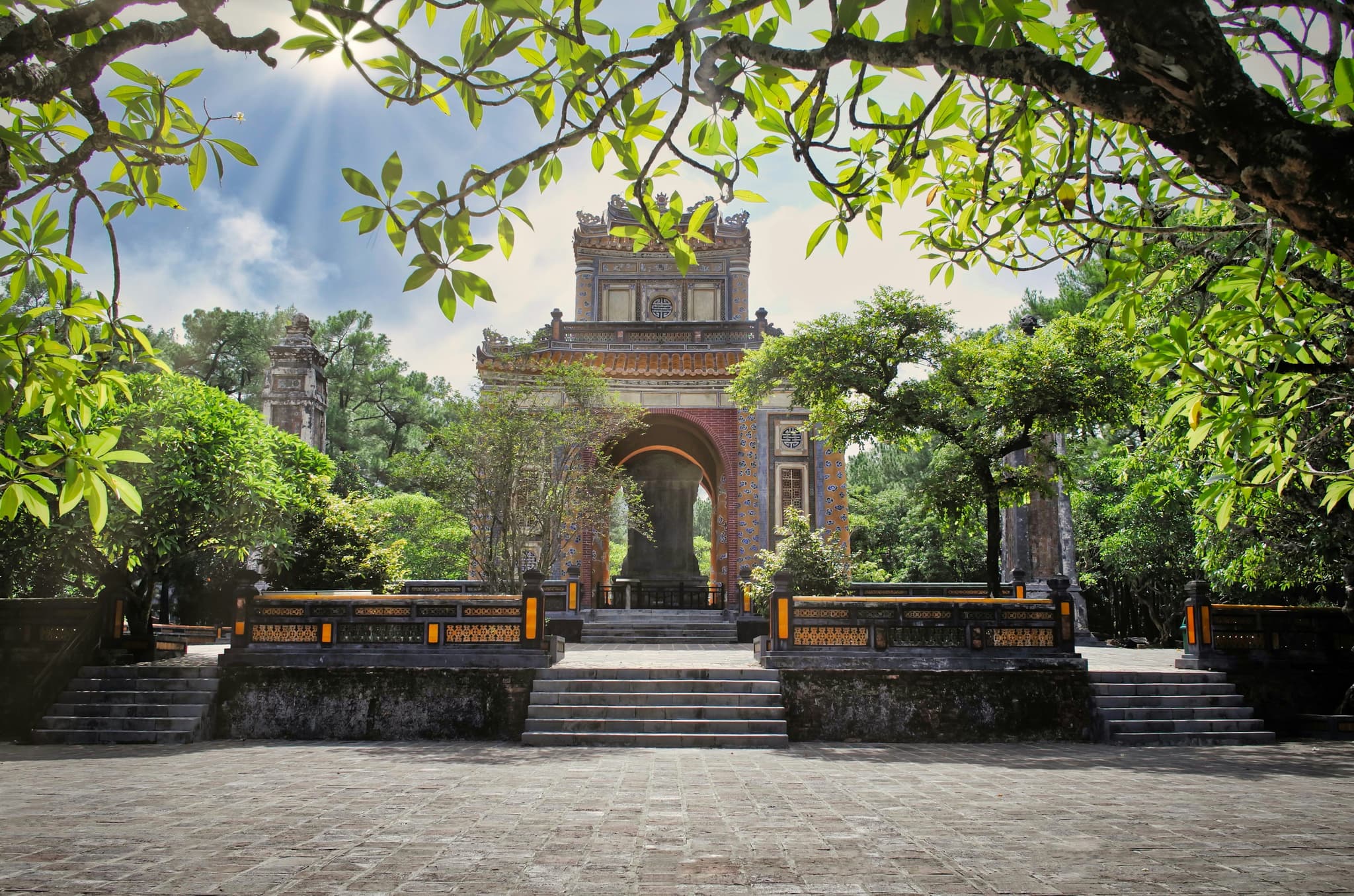 Temple in hue vietnam with a tree and stairs