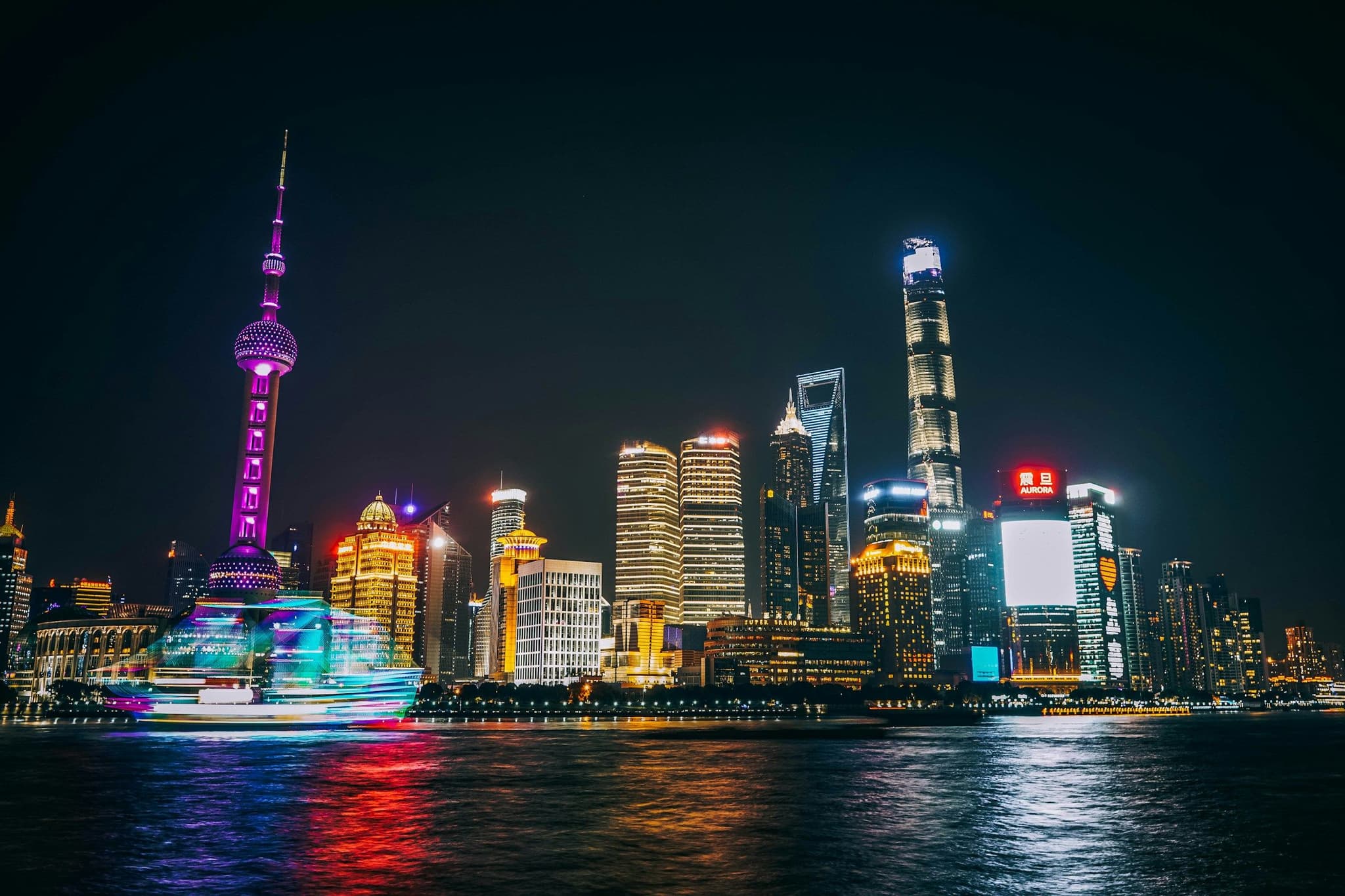 The Pudong skyline with the Oriental Pearl Tower, seen from the Bund at night