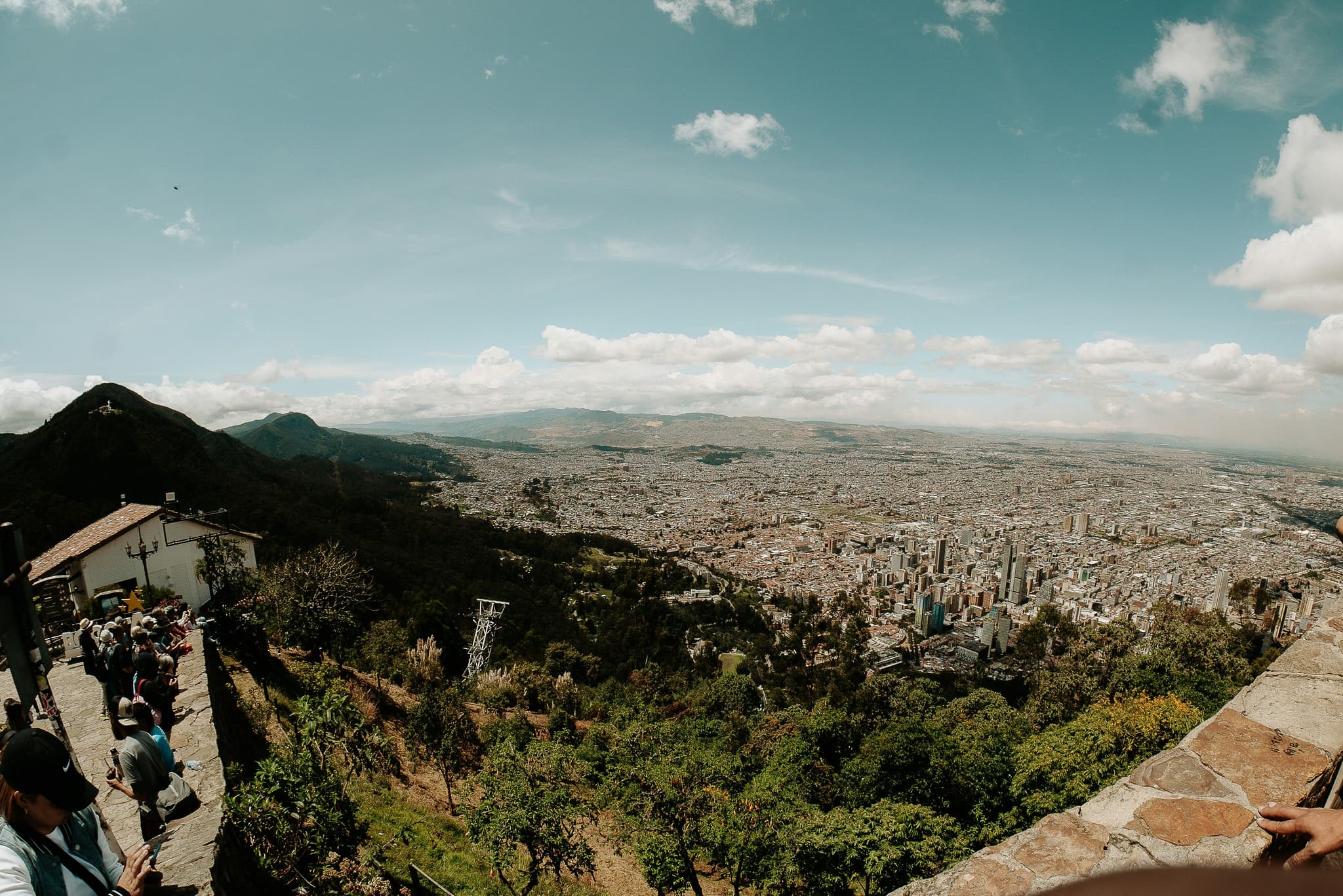 A panoramic view over Bogotá from the hilltop of Monserrate, the city spread out below.