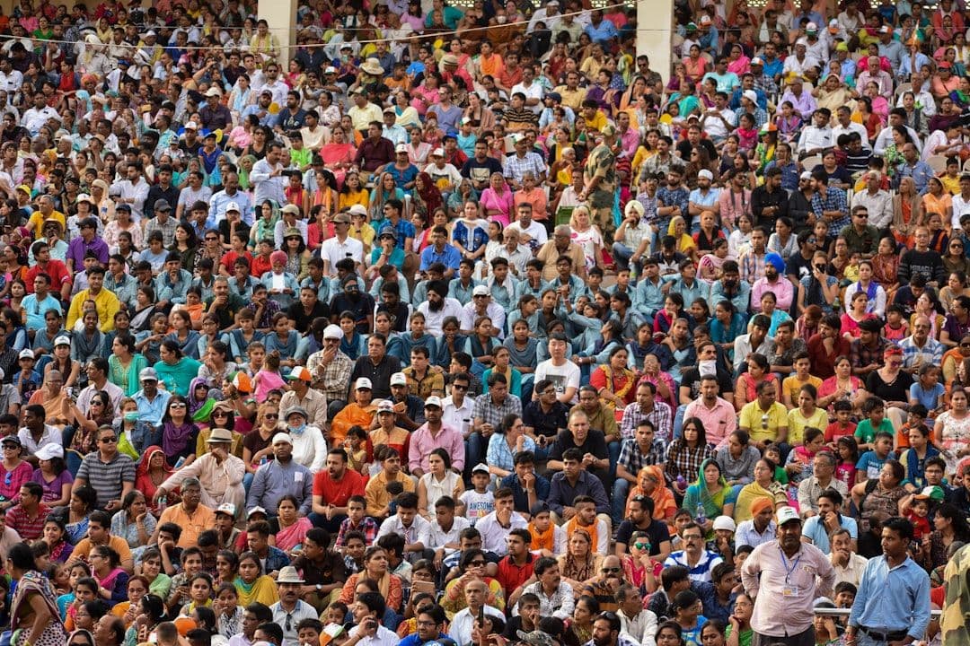 A large festival crowd gathered together, standing in for the La Tomatina atmosphere in Buñol