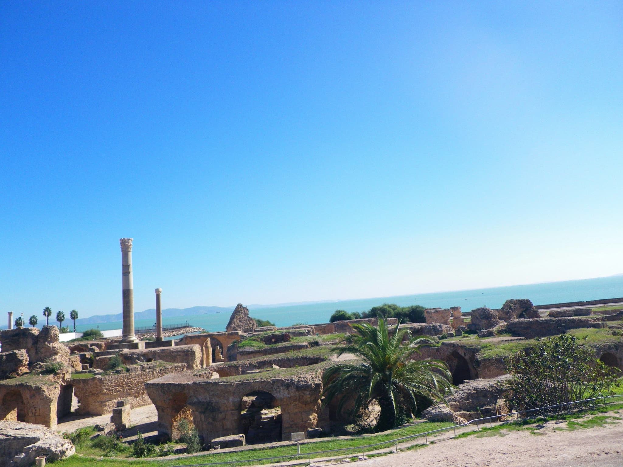 Ancient ruins of Carthage beside the sea under a clear sky