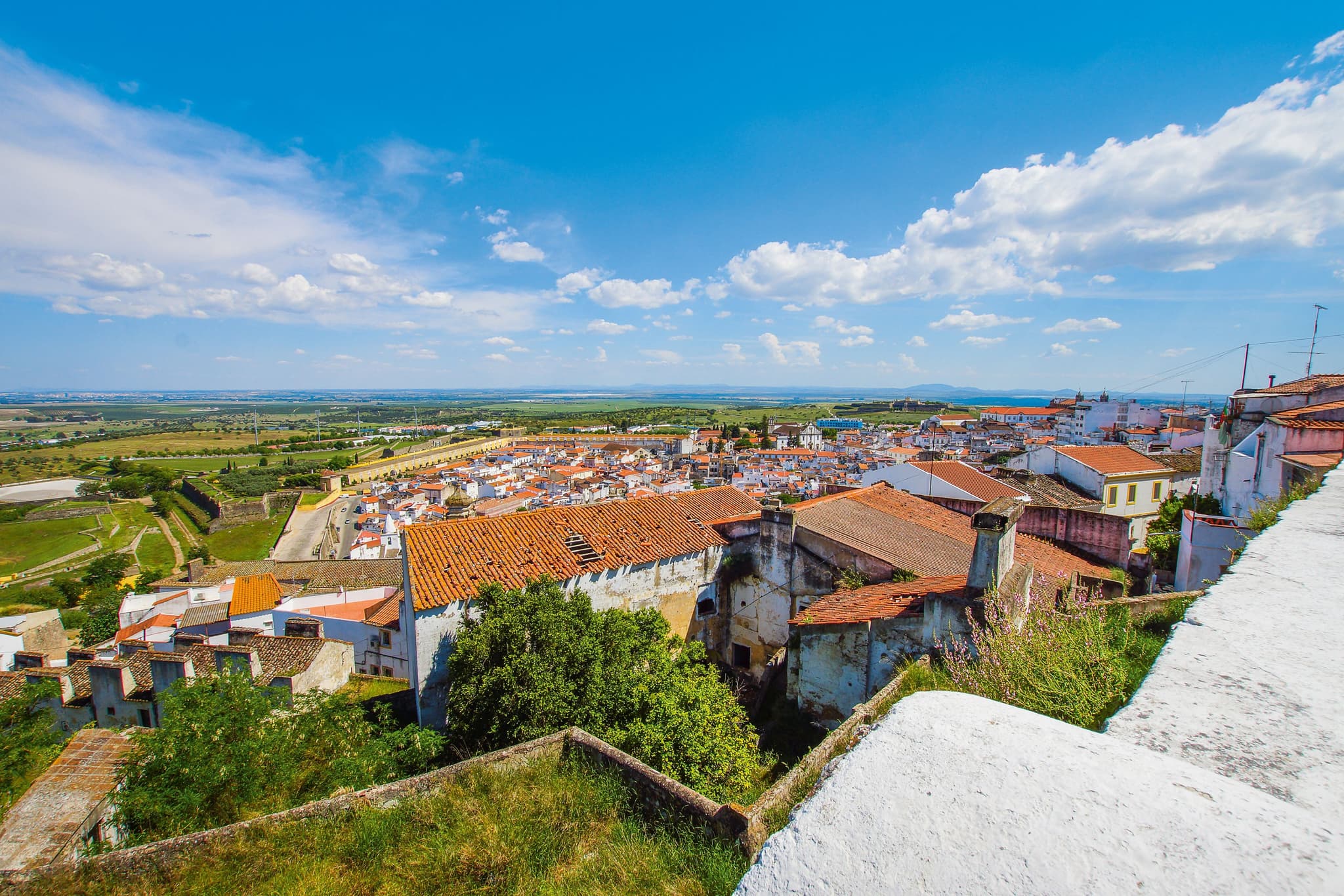 Aerial view of the city with red roofs in Elvas on a clear day