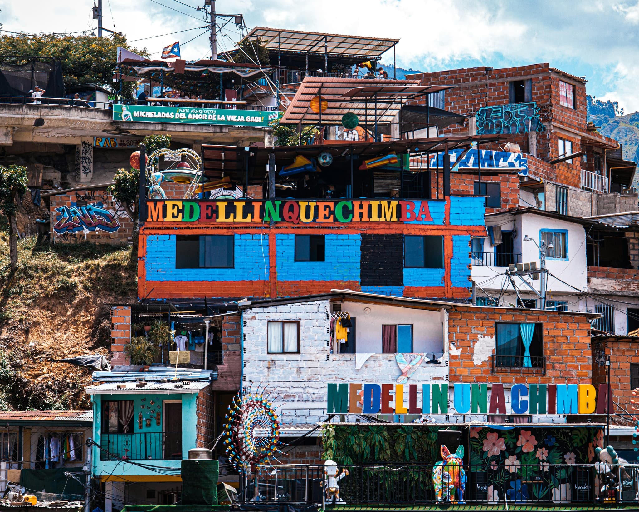 Medellín houses with colorful signs
