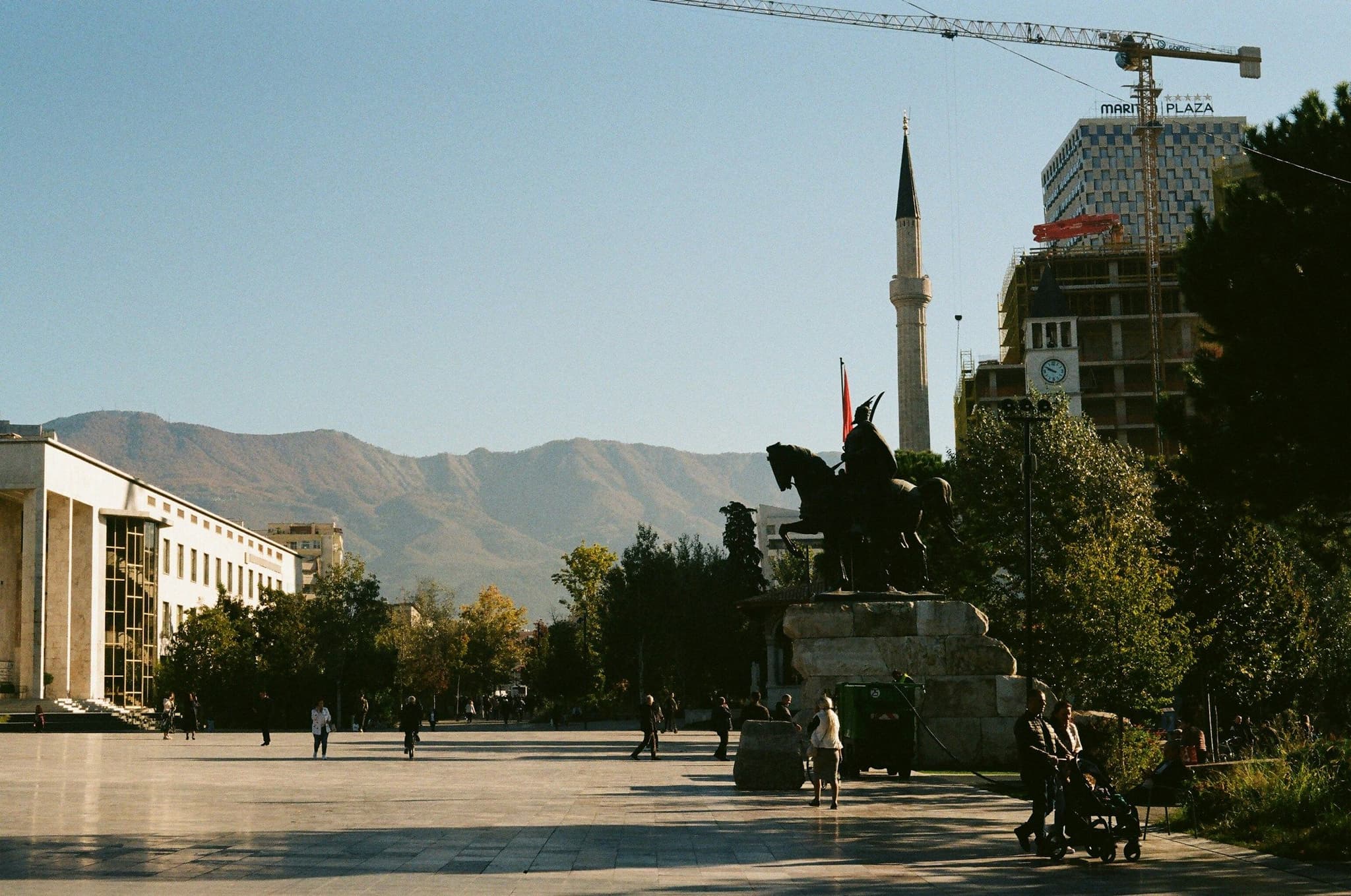 The Skanderbeg statue and a mosque minaret on Skanderbeg Square in Tirana