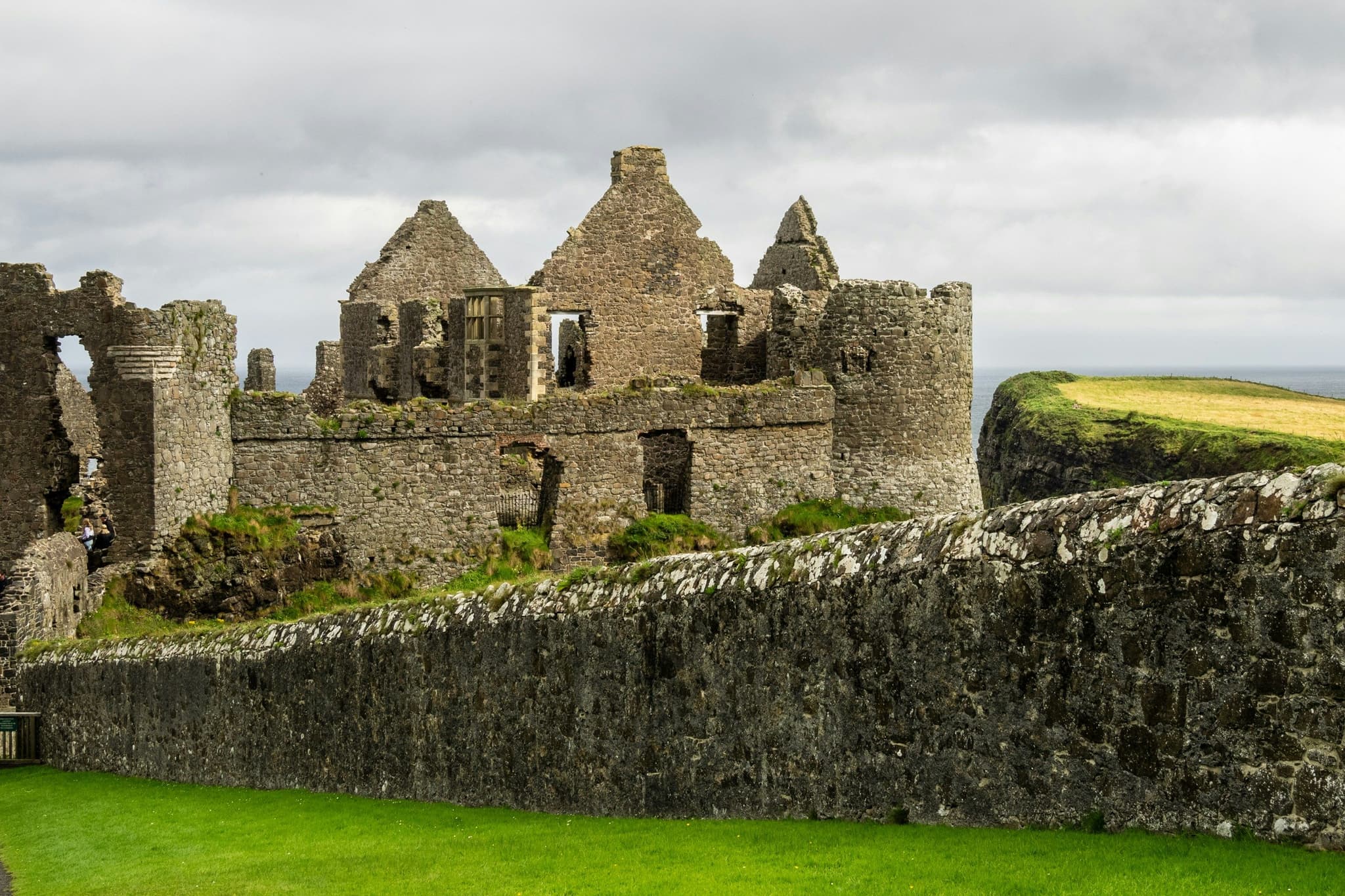 Stone wall and Charles Fort in Ireland on a cloudy day