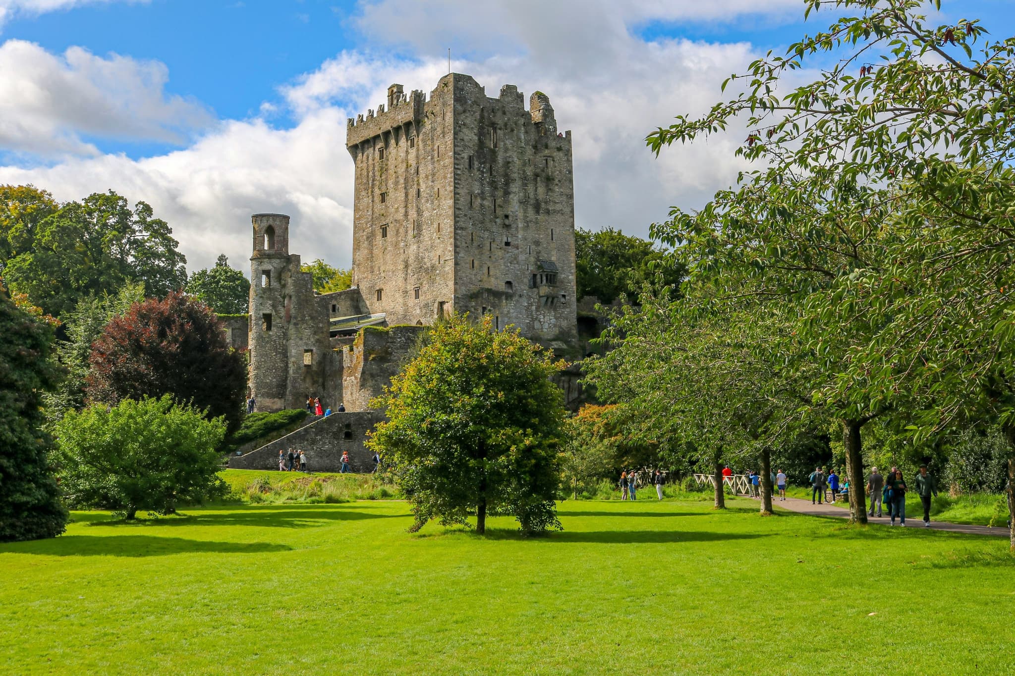 Blarney Castle surrounded by green grass without people but with trees