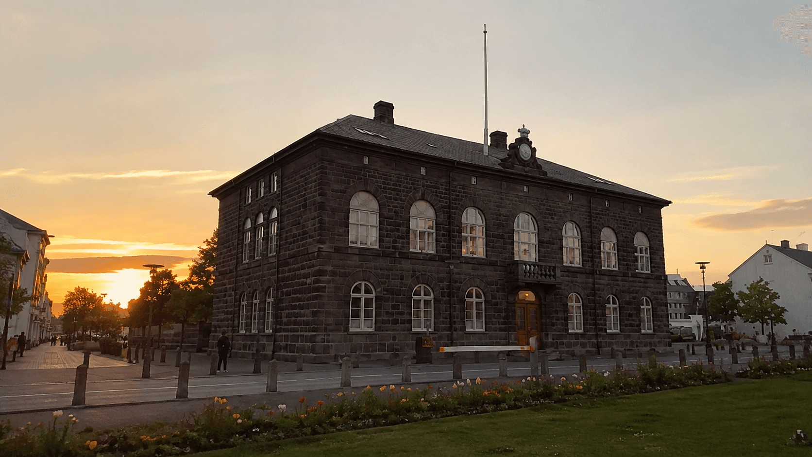 Althing building grey dark during sunset.