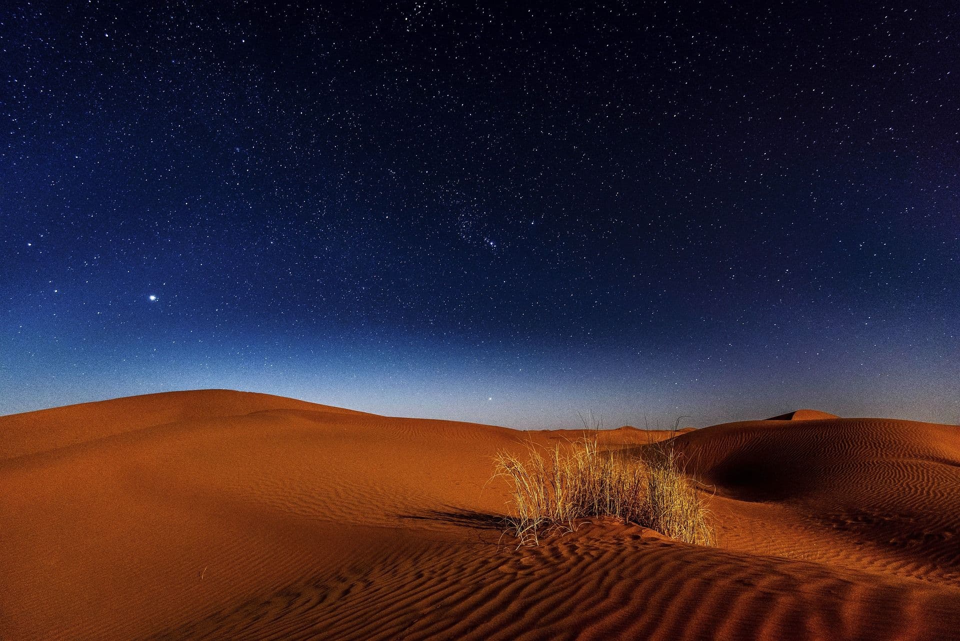Desert with sand and dark night sky
